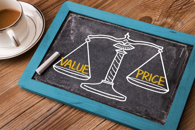 Scale weighing value and price painted on a chalkboard